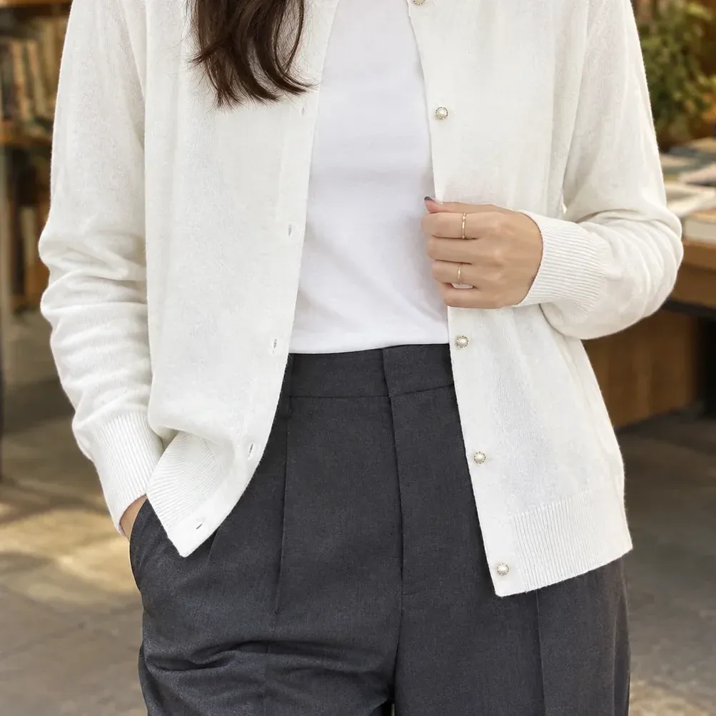 Brigitta Pearl-Button Cardigan — White lower garment detail