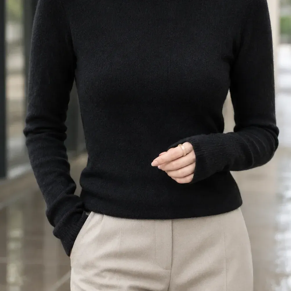 Apolline Slim Turtleneck — Black lower garment detail