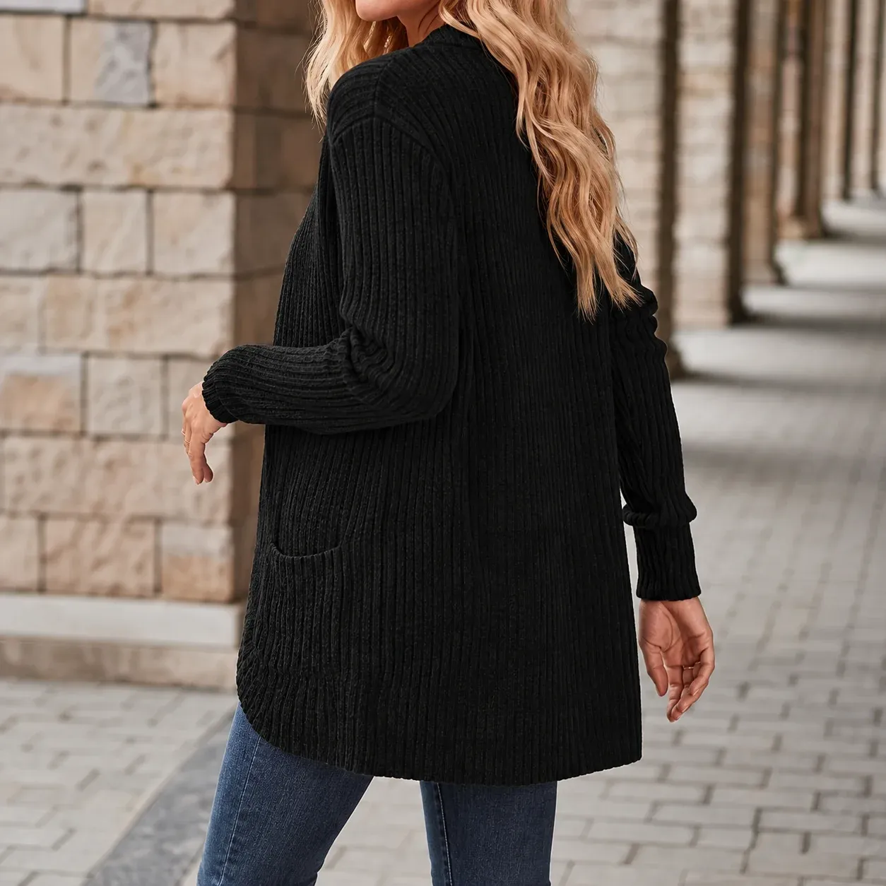 Eva Open Rib Cardigan — Black lower garment detail