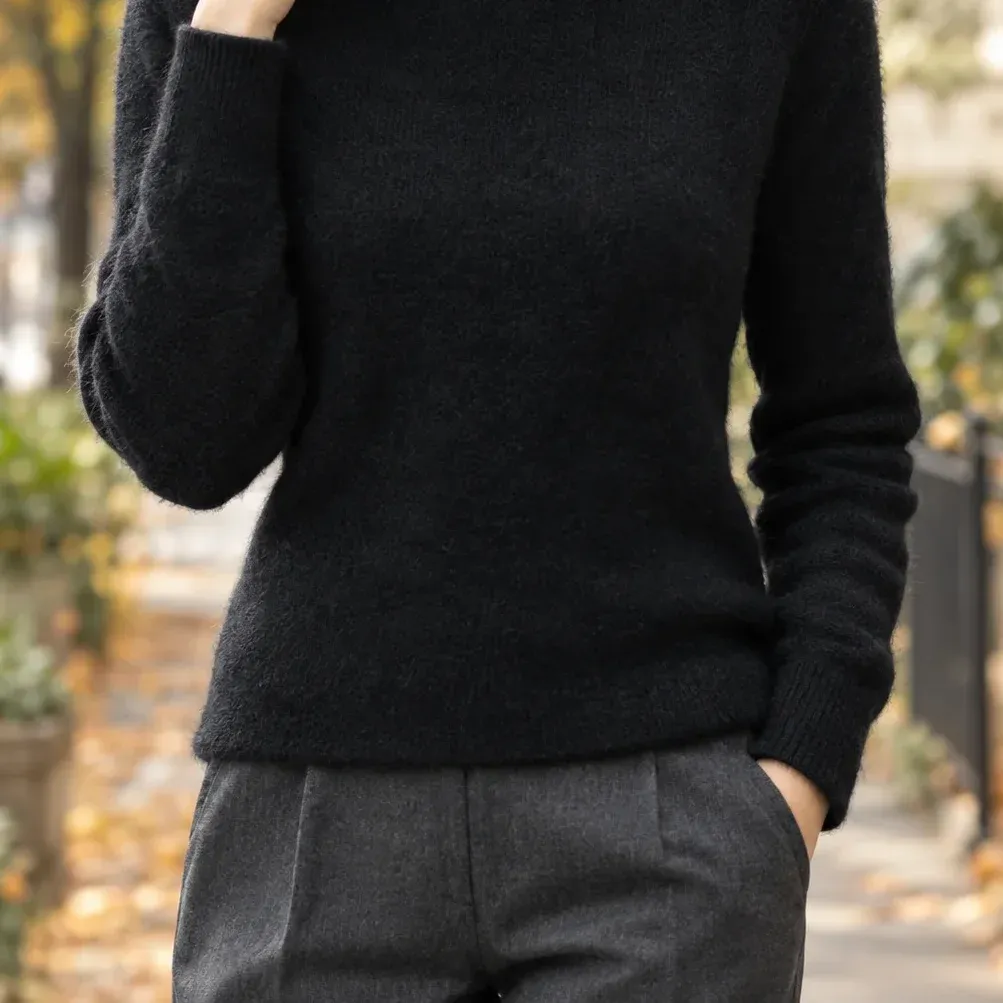 Alma Turtleneck Sweater — Black lower garment detail